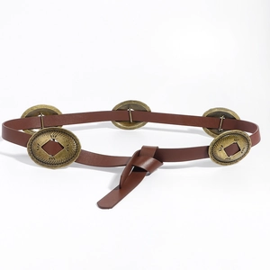 Detail of brown leather belt featuring vintage metal oval studs and a knotted closure