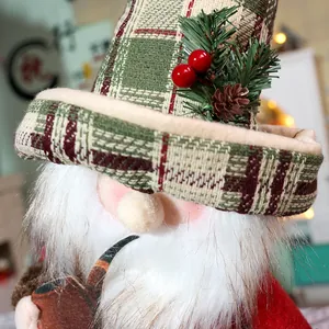 Detailed close-up of a Christmas gnome doll with green plaid hat and wooden pipe