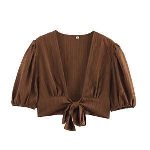 Brown beachwear set featuring a cropped tie-knot top with puff sleeves and crinkle texture