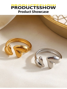 Detail of 18K gold and silver plated heart rings with a polished mirror finish