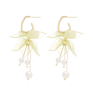 Elegant gold earrings with light green acrylic petals and white pearl tassels on white background