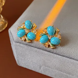 Vintage gold zircon flower earrings with blue turquoise stones and sparkling rhinestones