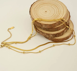 Detail view of 18K gold plated stainless steel double layer snake and bead chain necklace