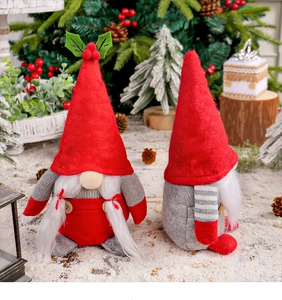Macro detail of Christmas gnome plush doll with knitted texture and wooden button