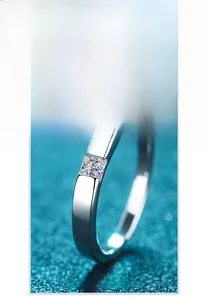 Detailed view of Princess cut Moissanite center stone on a polished S925 silver ring band