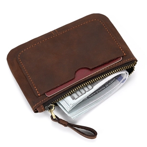 Macro detail of crazy horse leather wallet with external card slot and metal zipper