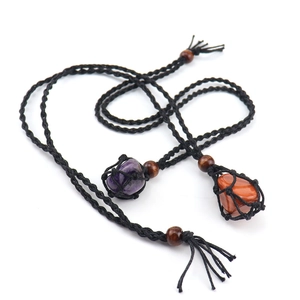 Detailed view of hand-woven black mesh necklaces with raw amethyst and agate stones