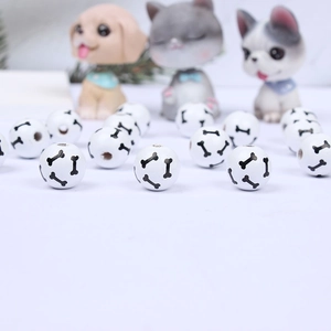 Round white wooden beads with black dog bone print for DIY pet accessory crafting