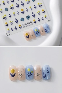 Detail of 3D embossed floral nail stickers featuring yellow flowers and blue butterflies