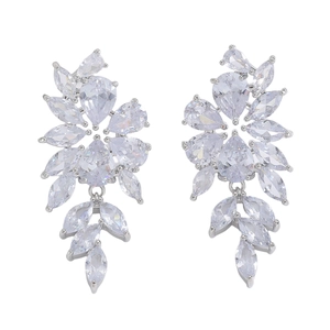 Macro detail of silver drop earrings featuring pear and marquise cut cubic zirconia gems