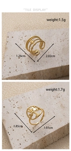 Detail of adjustable gold-plated tree of life and sun flower rings with weights