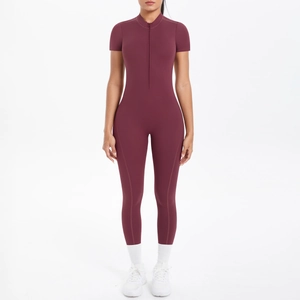 Detail view of burgundy yoga bodysuit featuring stand collar zipper and short sleeves