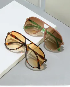 Detail of tortoise shell and pink pilot sunglasses on geometric steps, 2024 retro design