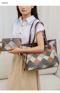 Detail of multi-color patchwork tote bag and clutch set with embossed crocodile texture