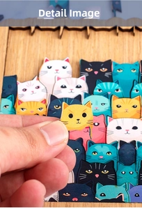 Detailed close-up showing the smooth edges and thick wood of colorful cat-themed puzzle pieces