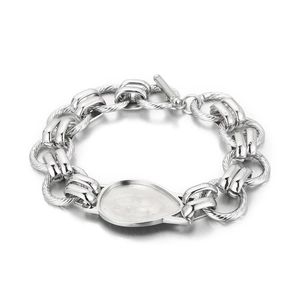 Macro shot of silver heavy chain bracelet with teardrop pendant and classic toggle clasp