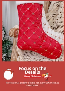 Detailed view of red velvet Christmas stocking with gold sequins and white faux fur trim
