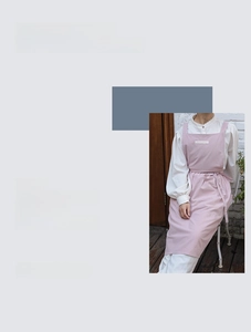 Detailed view of pale purple cotton apron featuring an adjustable waist tie and H-shape cut