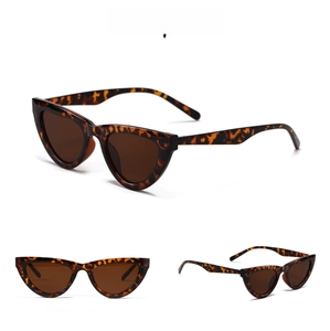 Detailed view of tortoiseshell cat-eye sunglasses with dark brown lenses for adults.
