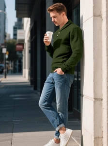 Detail of men's dark green waffle knit texture and three-button polo collar design