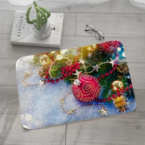 Absorbent flannel floor mat with festive Christmas ball ornaments and snowflakes on a wooden floor