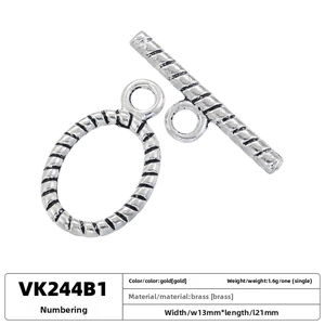 Macro detail of a 13x21mm spiral brass toggle clasp with silver finish for jewelry making