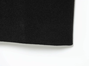 Close-up of high-quality black wool blend fabric showing soft texture and fine fuzzy fibers