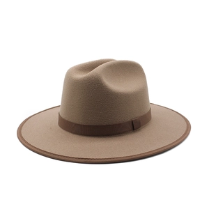 Detail of khaki wool fedora hat featuring a dark brown ribbon band and stitched brim edge