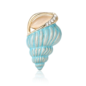 Elegant conch brooch with blue enamel and rhinestones on polished gold metal base