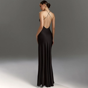 Detail of cross-back straps on a sleek black satin evening gown with backless design