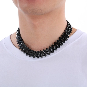 Black geometric diamond-cut stainless steel Cuban chain necklace worn by a male model