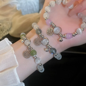 Three-piece set of cat eye stone bead bracelets with Fu character and bell pendants