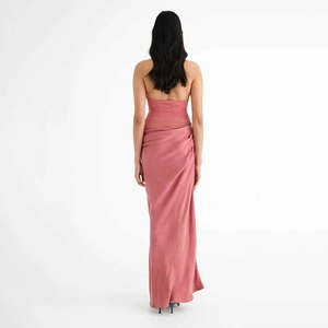 Detail view of pink satin maxi dress featuring a backless design and pleated texture