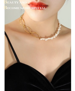 Detail of French baroque freshwater pearl and gold chain link geometric necklace