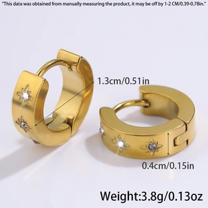 Detailed macro view showing the 1.3cm diameter and star pattern on gold hoop earrings