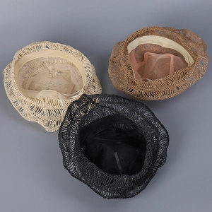 Close-up view showing the interior and woven texture of straw bucket hats