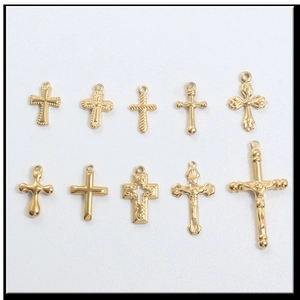 Detail view of 10 golden cross pendant styles with intricate textured metal designs