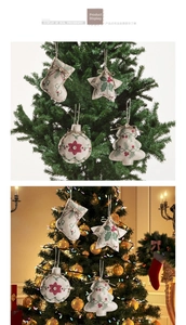 Detail of four rustic burlap Christmas ornaments with red holly berry prints and wooden buttons
