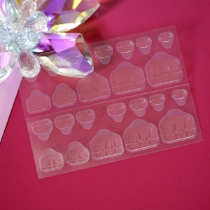 Detailed view of 24 pieces of transparent double-sided adhesive tabs for press-on nails