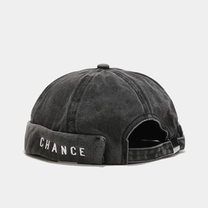 Detail of CHANCE embroidery on charcoal washed denim docker hat with metal buckle