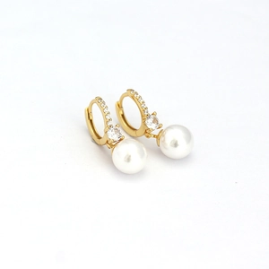 Elegant gold hoop earrings with small crystals and large hanging white pearls