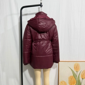 Back view of burgundy hooded cotton-padded coat featuring adjustable drawstring waist detail