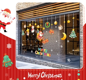 Christmas window stickers with Santa, reindeer and snowman on a store glass window