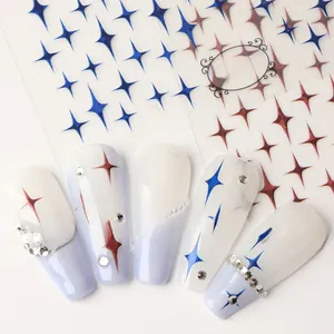 Macro shot of nail stickers with sparkling star patterns and fine rhinestone accents