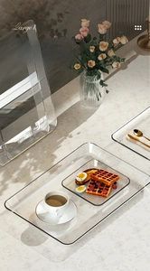Macro shot of large transparent PET tray for serving snacks and appetizers on tabletop