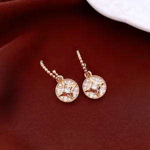 18K gold plated round star drop earrings with white zircon on deep red velvet