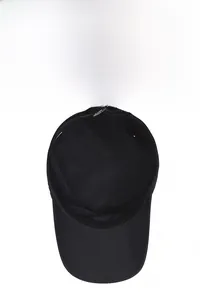 Inside view of quick-dry black cap showing breathable fabric, sweatband and stitching