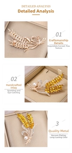 Detailed macro view showing gold plated crystal wheat brooch and secure pin clasp mechanism