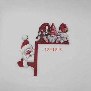 Detail of wooden Christmas door frame ornament showing dimensions 18x18.5 cm and Santa design