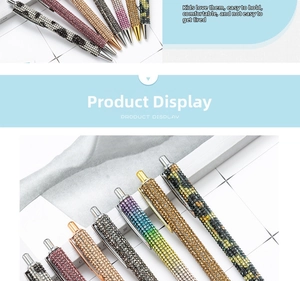 Detail of luxury rhinestone encrusted ballpoint pens in multiple metallic colors